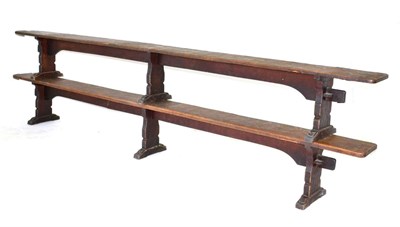 Lot 626 - A Pair of Robert  "Mouseman " Thompson Oak 12ft Benches, on three shaped supports, joined by a rail