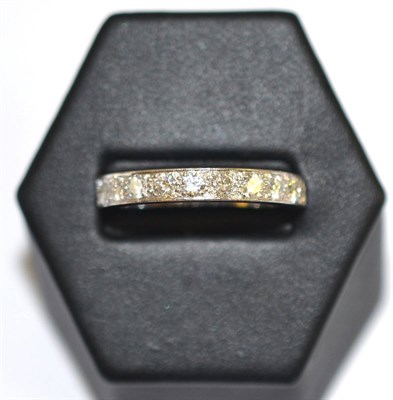 Lot 16 - A diamond half hoop ring, stamped '18CT', total estimated diamond weight 0.65 carat approximately