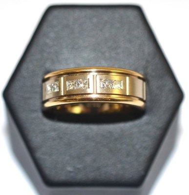 Lot 17 - A two colour diamond set band ring, stamped '14K'