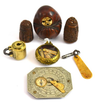 Lot 27 - An 18th century Continental reliquary; Bramah padlock; coquilla nut needle case; Japanese doll...