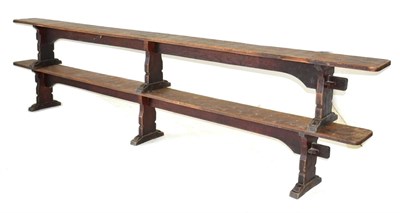 Lot 628 - A Pair of Robert  "Mouseman " Thompson Oak 12ft Benches, on three shaped supports, joined by a rail