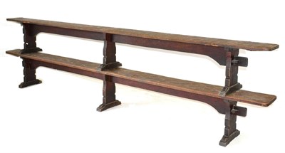 Lot 630 - A Pair of Robert  "Mouseman " Thompson Oak 12ft Benches, on three shaped supports, joined by a rail