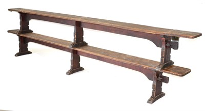 Lot 632 - A Pair of Robert  "Mouseman " Thompson Oak 12ft Benches, on three shaped supports, joined by a rail