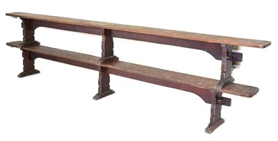 Lot 634 - A Pair of Robert  "Mouseman " Thompson Oak 12ft Benches, on three shaped supports, joined by a rail