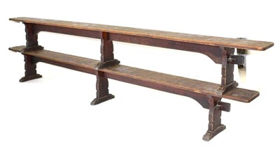 Lot 636 - A Pair of Robert  "Mouseman " Thompson Oak 12ft Benches, on three shaped supports, joined by a rail