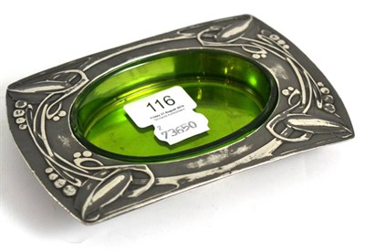 Lot 116 - A pewter Archibald Knox designed Liberty & Co butter dish with a green glass liner, model...