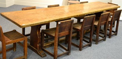 Lot 637 - A Robert  "Mouseman " Thompson Oak 10ft Refectory Table, on two shaped supports, joined by a...