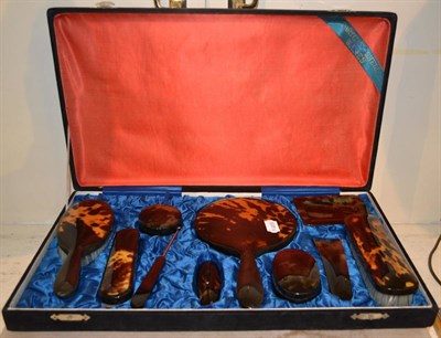 Lot 126 - An early 20th century tortoiseshell backed dressing table set retailed by Forsyth Ltd....