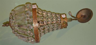 Lot 141 - An early 20th century gilt metal bag light with cut glass drops