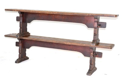 Lot 642 - A Pair of Robert  "Mouseman " Thompson Oak 6ft Benches, on shaped supports, joined by a rail,...