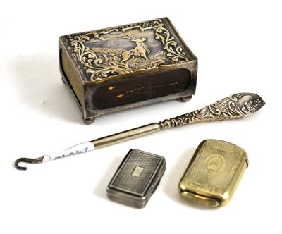 Lot 181 - A silver vinaigrette, a matchbox holder embossed with a stag, a button hook and a plated vesta