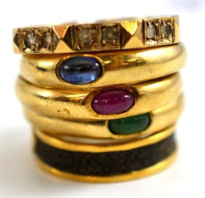 Lot 189 - A mourning ring, three stone set dress rings and an eternity ring (5)