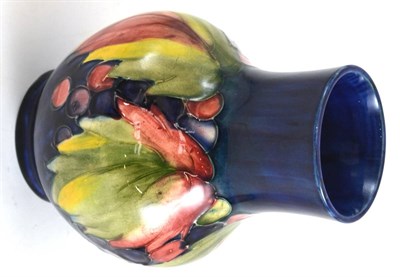 Lot 203 - A Walter Moorcroft leaf and grape pattern vase, impressed factory marks, facsimile signature...