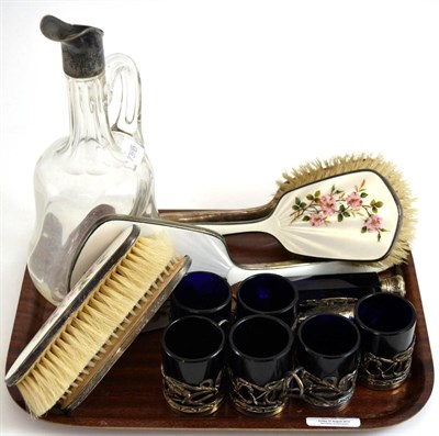 Lot 205 - A five piece silver and enamel dressing table set, a claret jug (lacking stopper), six silver...