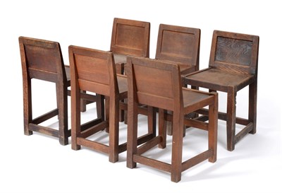 Lot 646 - A Set of Six Robert  "Mouseman " Thompson Oak Panel Back Chairs, solid seats, joined by rails, each