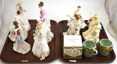 Lot 230 - Eleven Royal Doulton figures, Clarice Cliff mugs and a Buckingham Palace commemorative mug