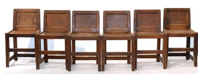 Lot 648 - A Set of Six Robert  "Mouseman " Thompson Oak Panel Back Chairs, solid seats, joined by rails, each