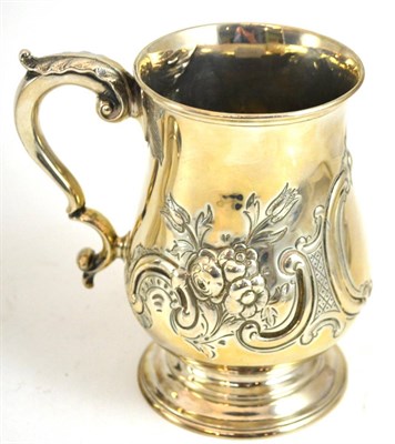 Lot 242 - A Victorian silver tankard with embossed decoration, London 1845