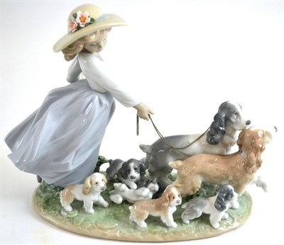 Lot 246 - A large Lladro group - 'Puppy Parade', boxed