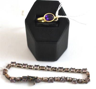 Lot 265 - A 9ct gold purple stone set ring, bracelet with clasp stamped '9k' and a dress bracelet