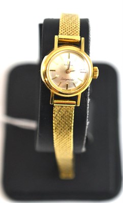 Lot 273 - Lady's 14ct gold wristwatch, signed Omega Ladymatic, with Omega box and booklet