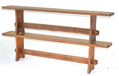 Lot 653 - A Pair of Acorn Industries Oak 6ft Benches, on two shaped supports, joined by a rail, with recessed