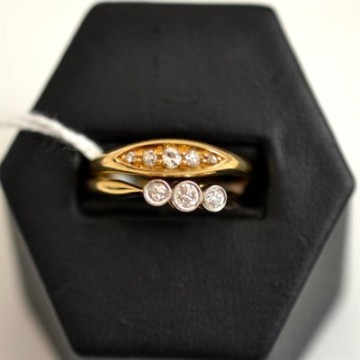 Lot 305 - An 18ct gold diamond five stone ring and a diamond three stone ring (2)