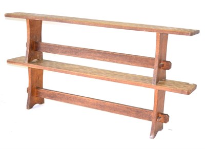 Lot 657 - A Pair of Acorn Industries Oak 6ft Benches, on two shaped supports, joined by a rail, with recessed