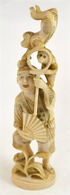 Lot 336 - A Japanese Meji period one piece carved ivory okimono of a man with two performing monkeys, the man