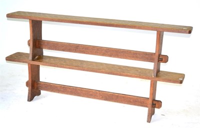 Lot 659 - A Pair of Acorn Industries Oak 6ft Benches, on two shaped supports, joined by a rail, with recessed