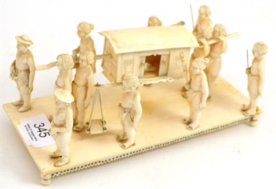 Lot 345 - An ivory figural group depicting a carriage (a.f.), circa 1920