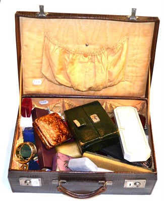 Lot 371 - A suitcase filled with assorted silver, white metal and costume jewellery