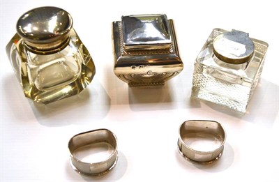 Lot 376 - Two silver mounted inkwells, a small silver caddy and two silver napkin rings