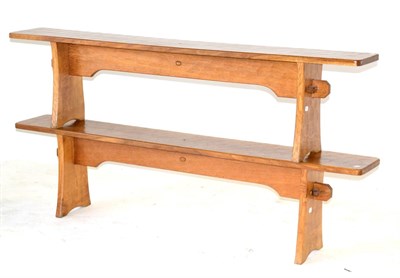 Lot 665 - A Pair of Acorn Industries Oak 6ft Benches, on two shaped supports, joined by a rail, with recessed