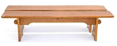 Lot 667 - A Pair of Acorn Industries Oak 6ft Benches, on two shaped supports, joined by a rail, with recessed