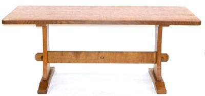 Lot 668 - An Acorn Industries Oak 6ft Refectory Table, on two shaped supports, joined by a stretcher,...