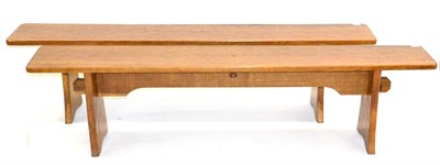 Lot 669 - A Pair of Acorn Industries Oak 6ft Benches, on two shaped supports, joined by a rail, with recessed