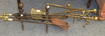 Lot 1040 - Two sets of brass fire irons and a pair of andirons