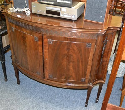 Lot 1044 - A bow fronted cupboard