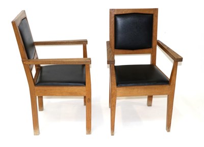 Lot 676 - A Pair of Acorn Industries Oak Arm Chairs, with drop-in black vinyl seats and backs, on...