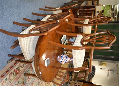 Lot 1066 - A reproduction pedestal dining table, eight chairs, sideboard, sheet music cabinet and a cupboard