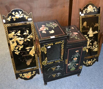 Lot 1067 - A Japanese lacquered small chest and two panels