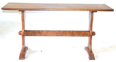 Lot 680 - An Acorn Industries Oak Refectory Table, the rectangular top on shaped supports joined by a...