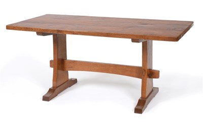 Lot 681 - A Colin  "Beaverman " Almack Oak 5ft5in Refectory Table, on two shaped supports joined by a...