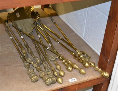 Lot 1119 - Three sets of brass fire irons