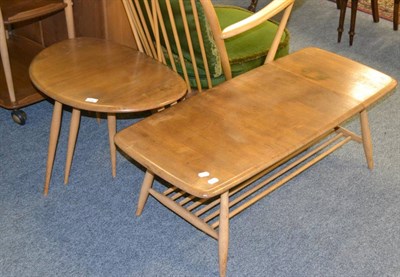 Lot 1135 - An Ercol pebble elm and beech nest of tables, one labelled, largest 65cm wide by 40cm high and...