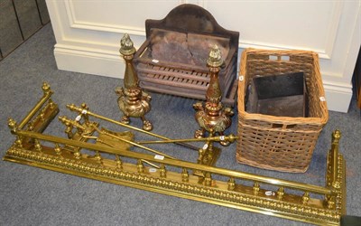 Lot 1147 - Gilt metal mounted fire basket, companion set, log basket, fender and two andirons