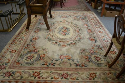 Lot 1150 - Savonnerie design carpet, China, the pale mushroom field centred by an oval panel enclosed by...