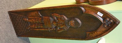 Lot 1200 - A carved oak lancet panel