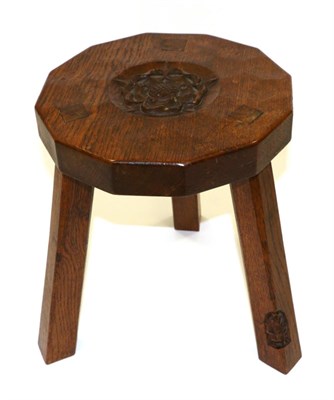 Lot 689 - A Thomas  "Gnomeman " Whittaker Oak Stool, the top with a carved Yorkshire rose, on three legs,...